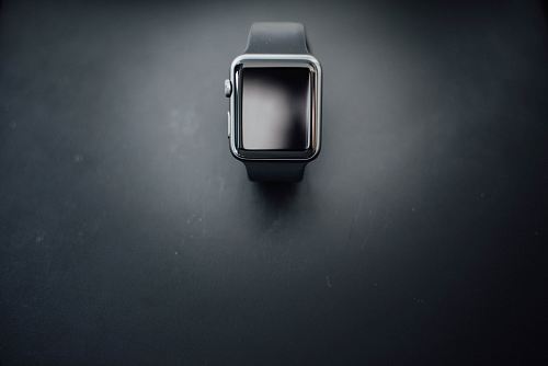 shallow focus photography of silver Apple Watch with black Sport Band